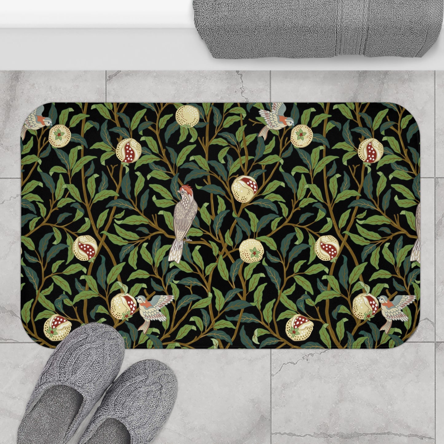 Microfibre bath mat with a design inspired by William Morris featuring birds and pomegranates on a dark background.