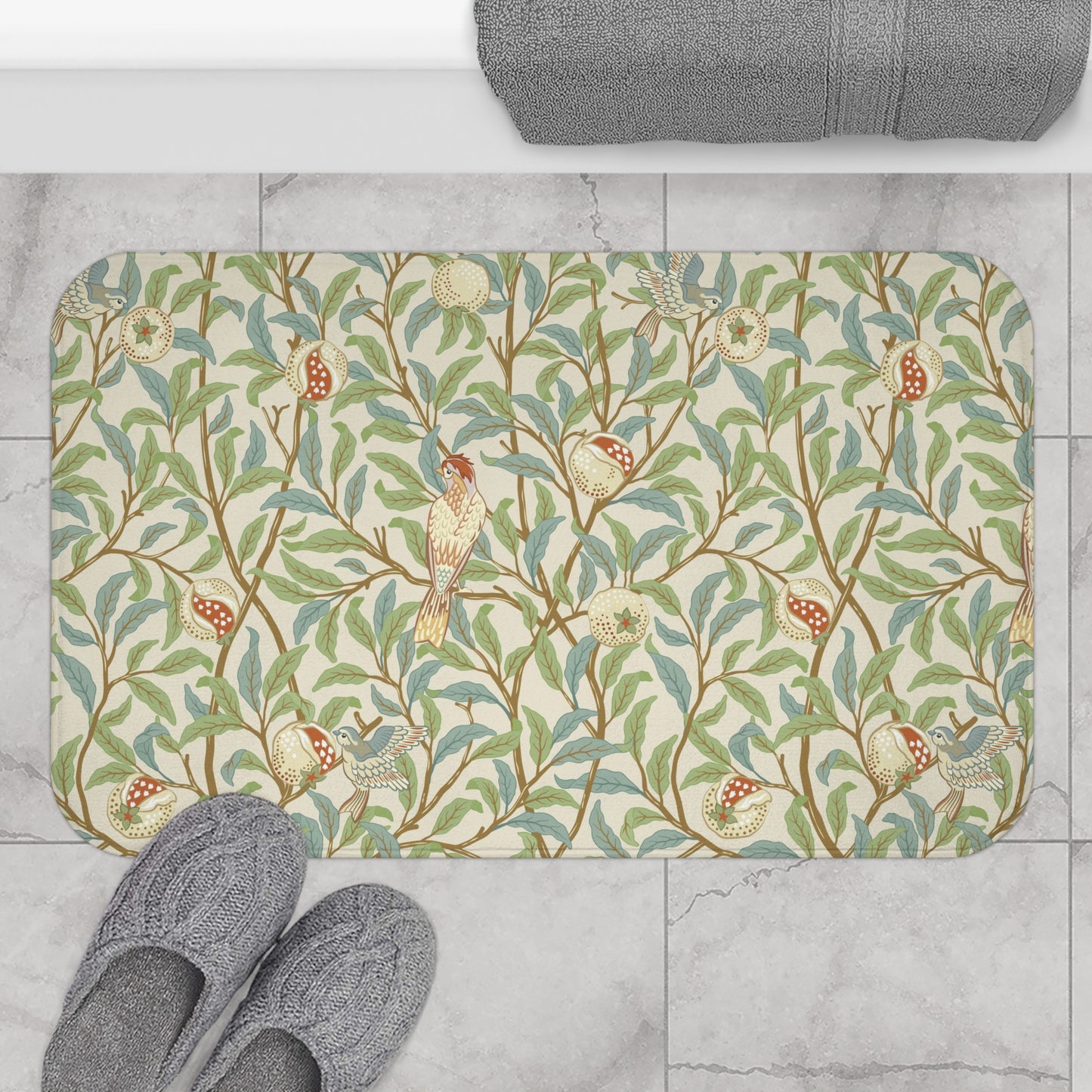Microfibre bath mat with a floral pattern featuring birds and pomegranates in a beige colour inspired by William Morris.