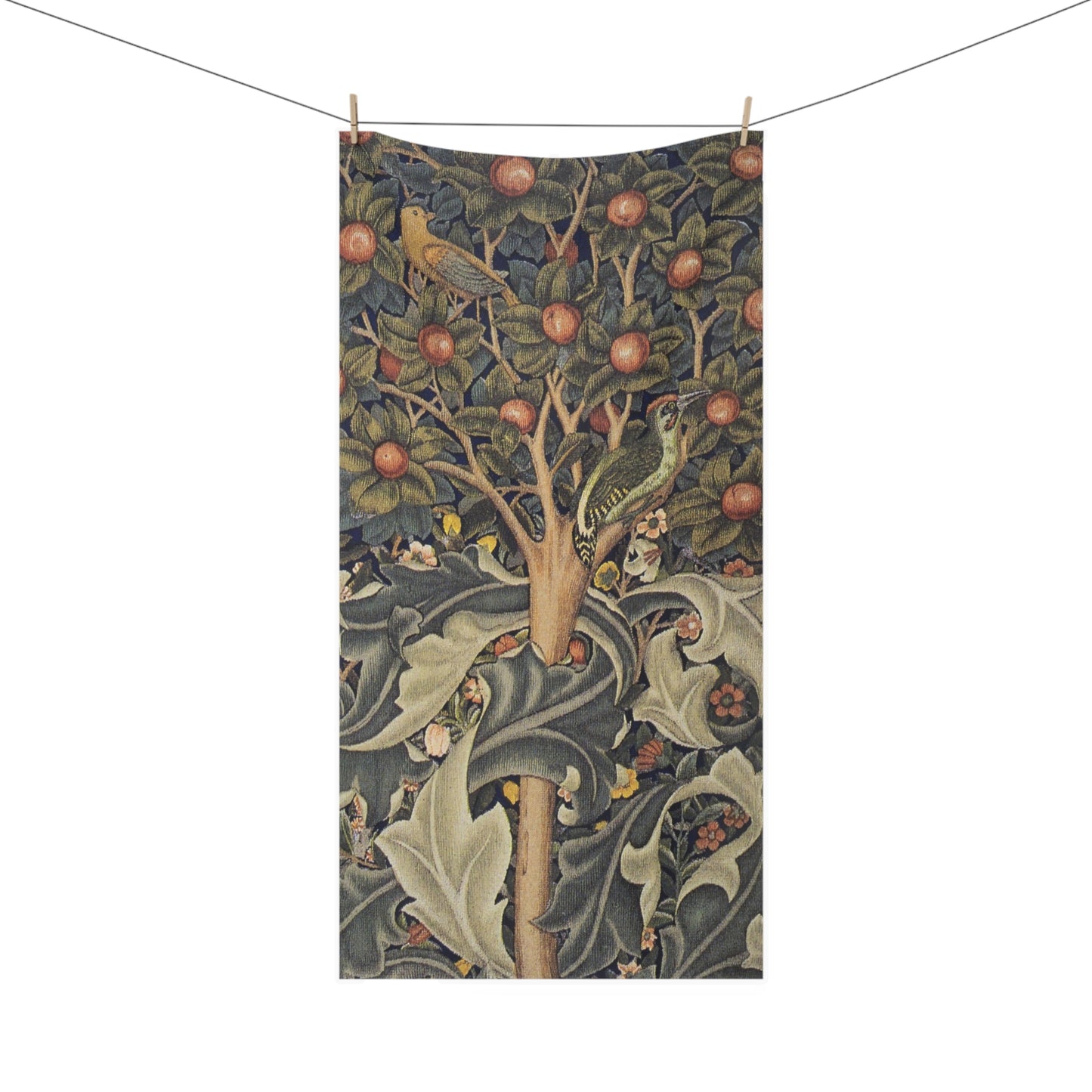 A rectangular textile hanging from a clothesline with two wooden clips, featuring a detailed vintage-style botanical illustration of an apple tree with birds and swirling foliage in muted blue-gray, olive green, beige, and rust tones.