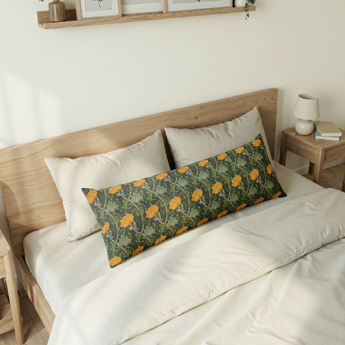 Bedroom with a wooden bed frame, white bedding, and a camouflage-patterned pillow.