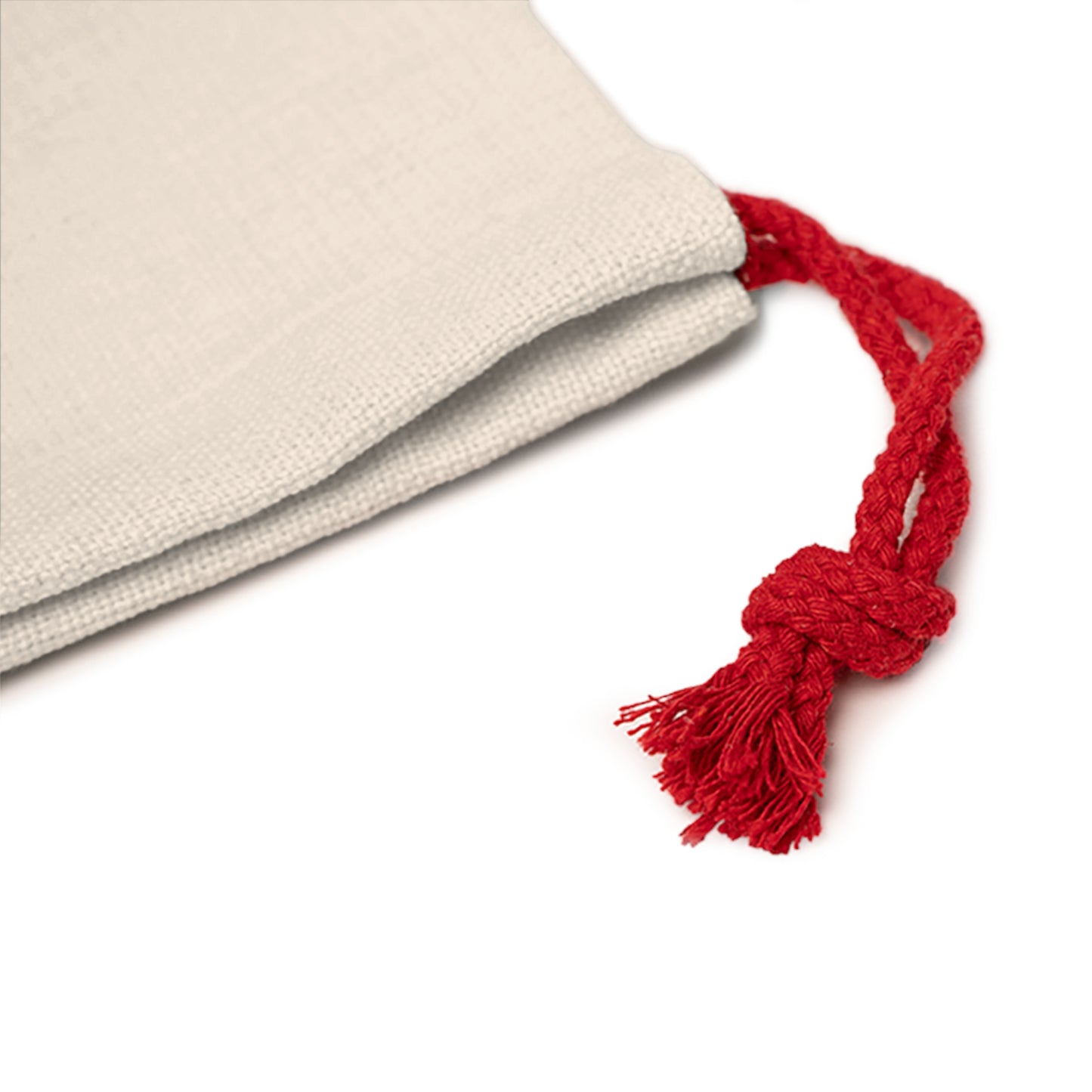 Beige fabric with a red tassel on a white background