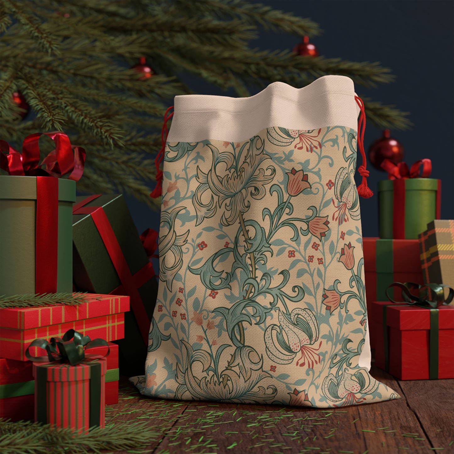 A beige and colourful William Morris & Co floral-patterned Christmas Santa sack with a red drawstring.