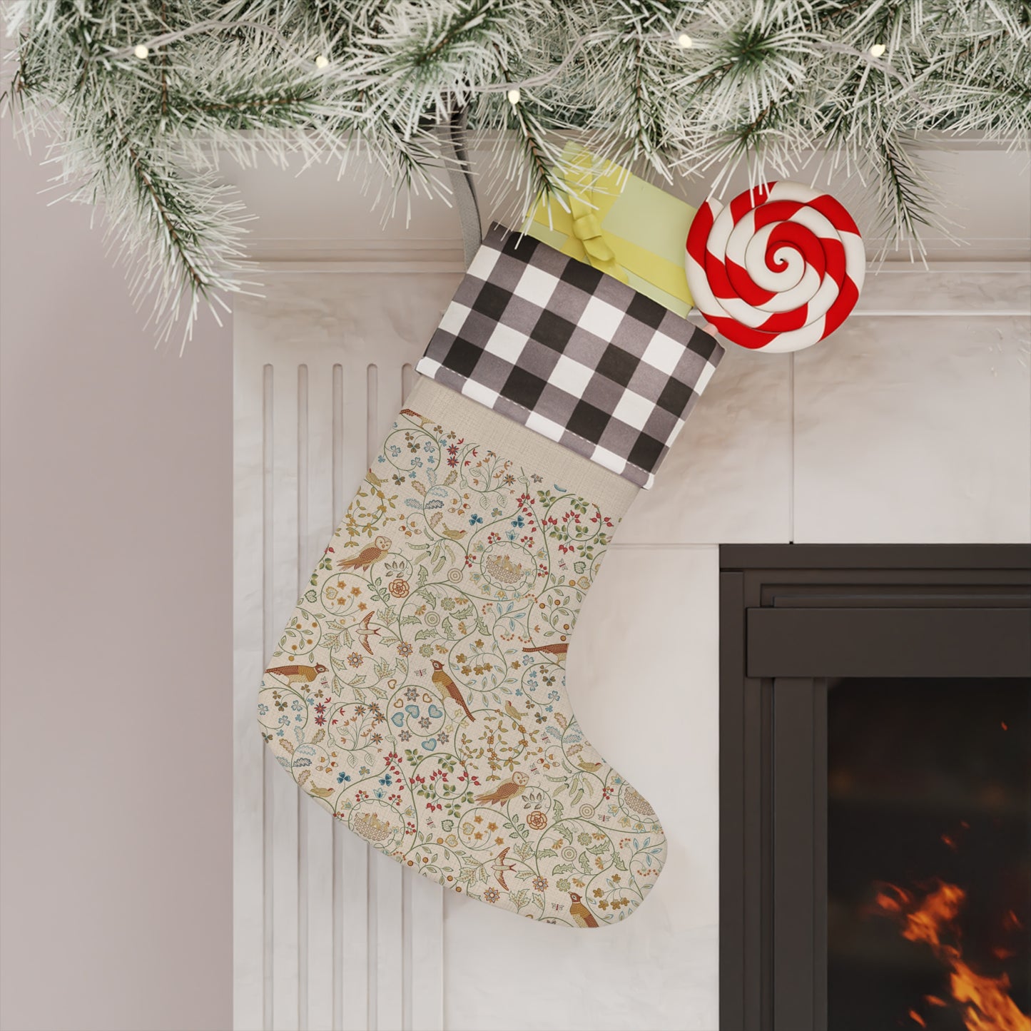 Decorative Christmas stocking hanging by a fireplace with a lollipop ornament.