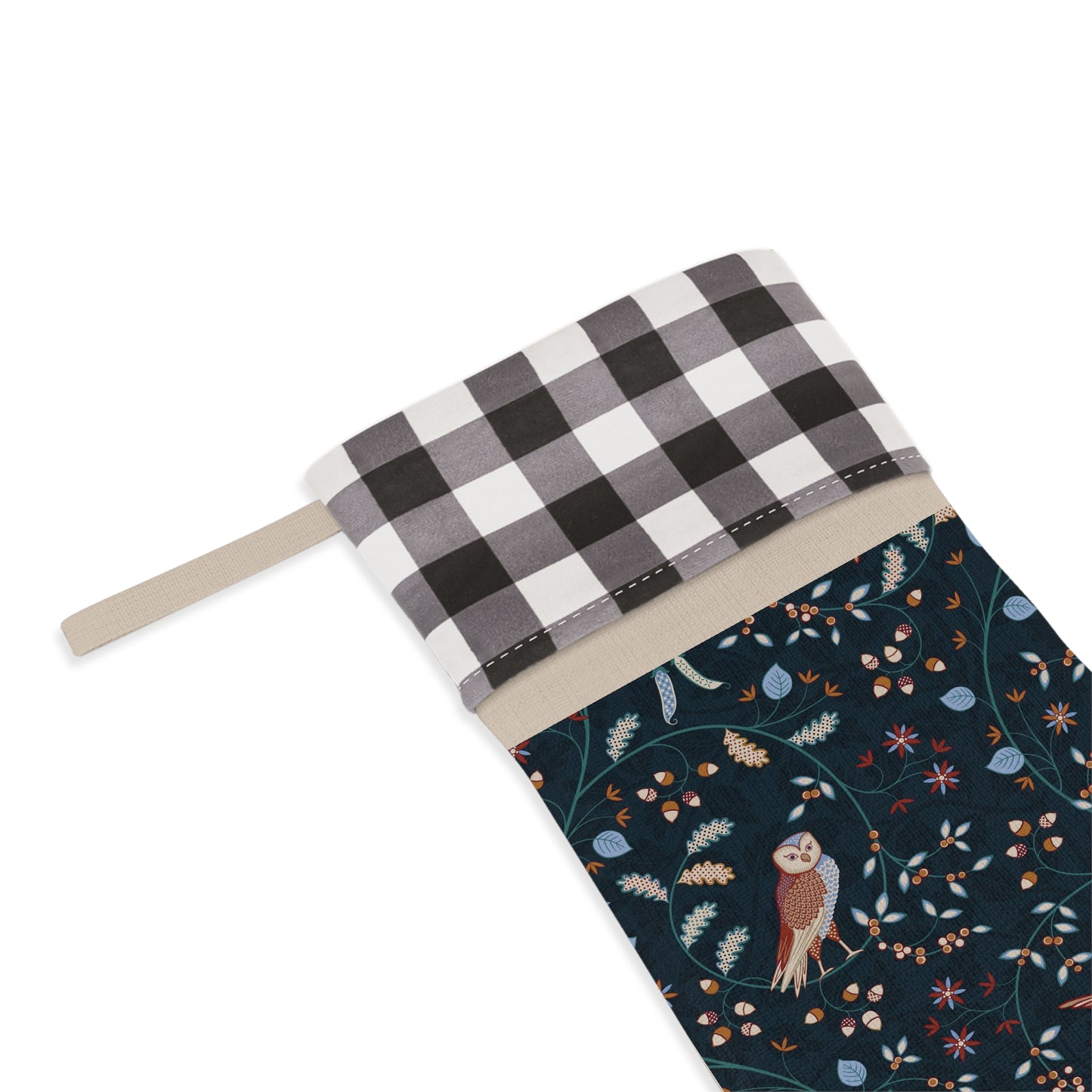 Christmas stocking with checkered top and owl patterned bottom on a white background