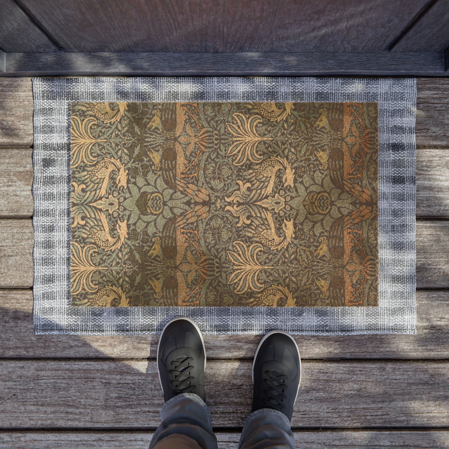 Decorative doormat with intricate patterns on a wooden floor