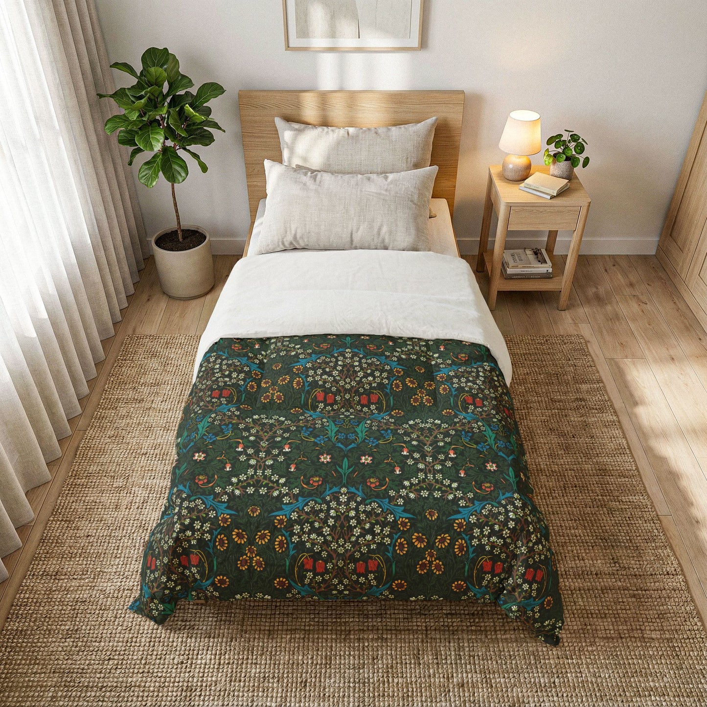 A single bed styled in a bright, modern bedroom, featuring a dark green quilt with a detailed botanical and floral pattern on the lower half and solid white on the upper half.