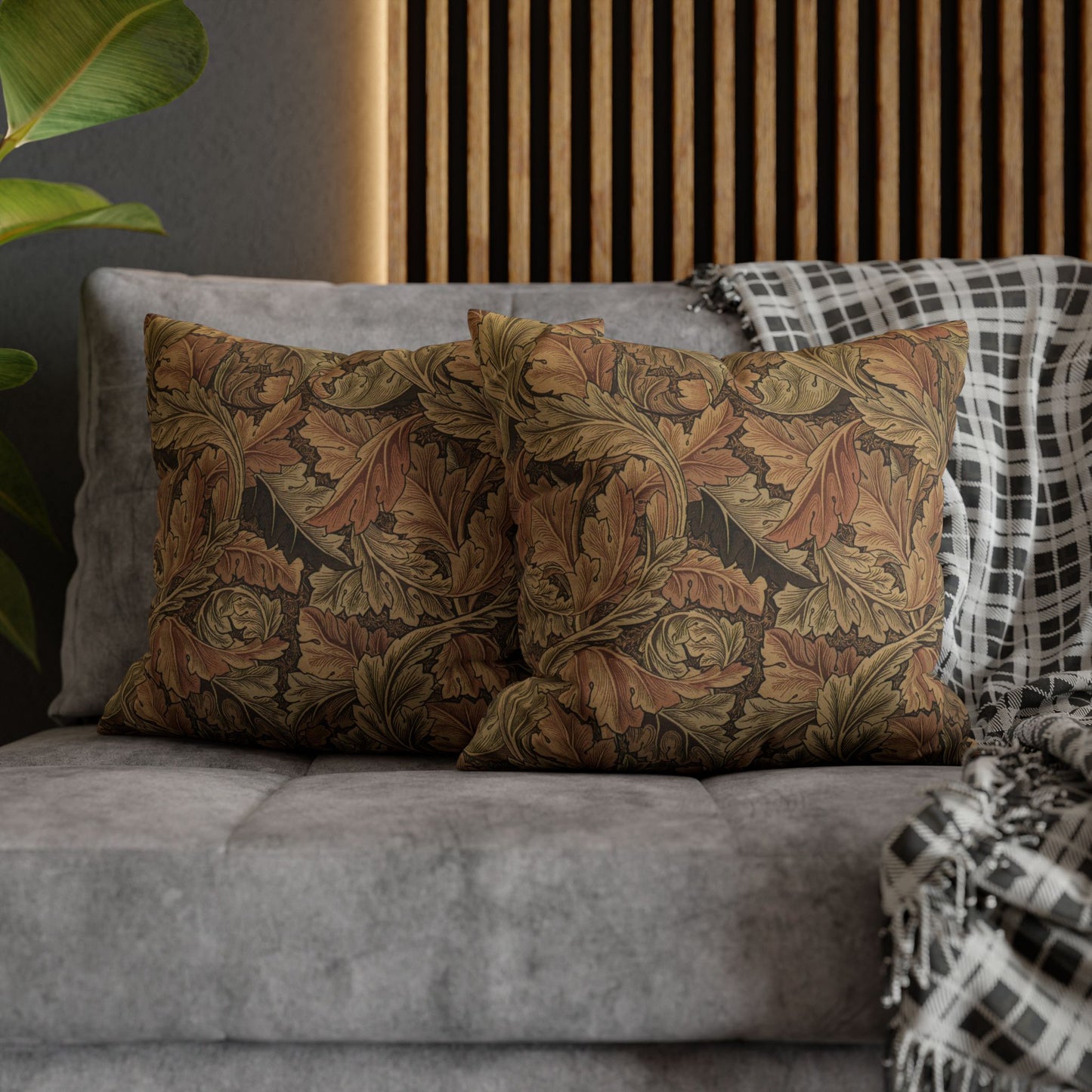 Decorative pillows on a sofa with a wooden headboard in the background