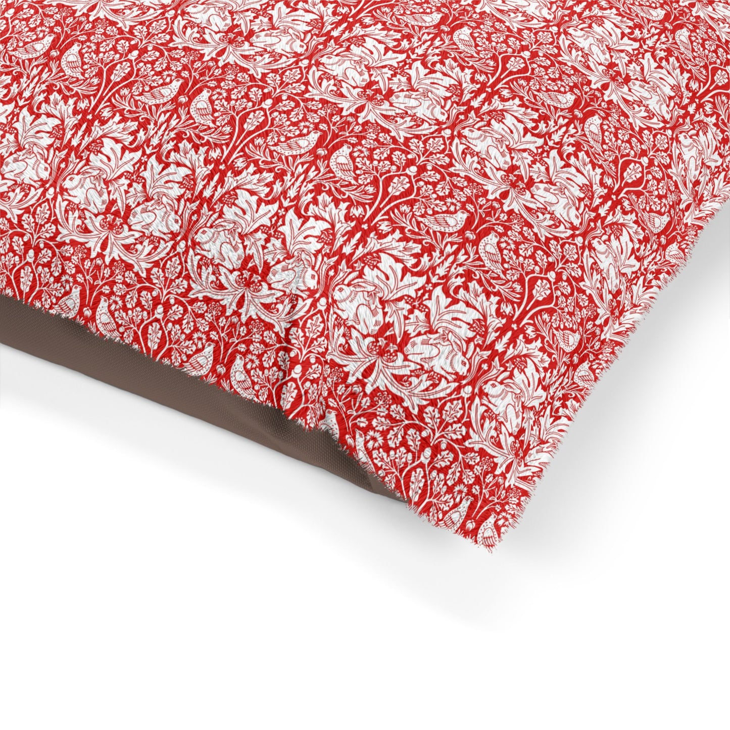 Red and white floral patterned fabric on a white background