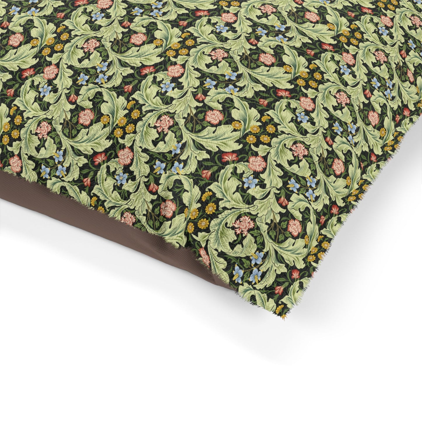 Floral and leaf patterned fabric on a white background
