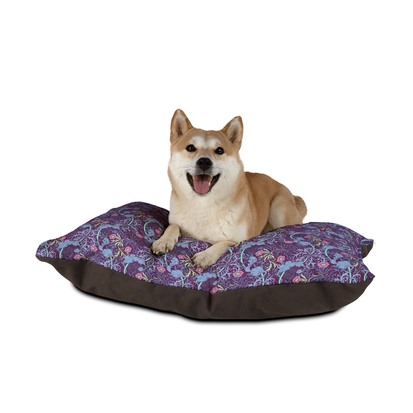 Dog lying on a floral-patterned pet bed with a white background