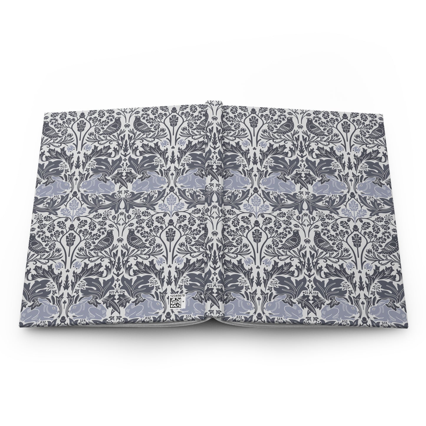 Flat notebook with a William Morris & Co floral pattern on a white background