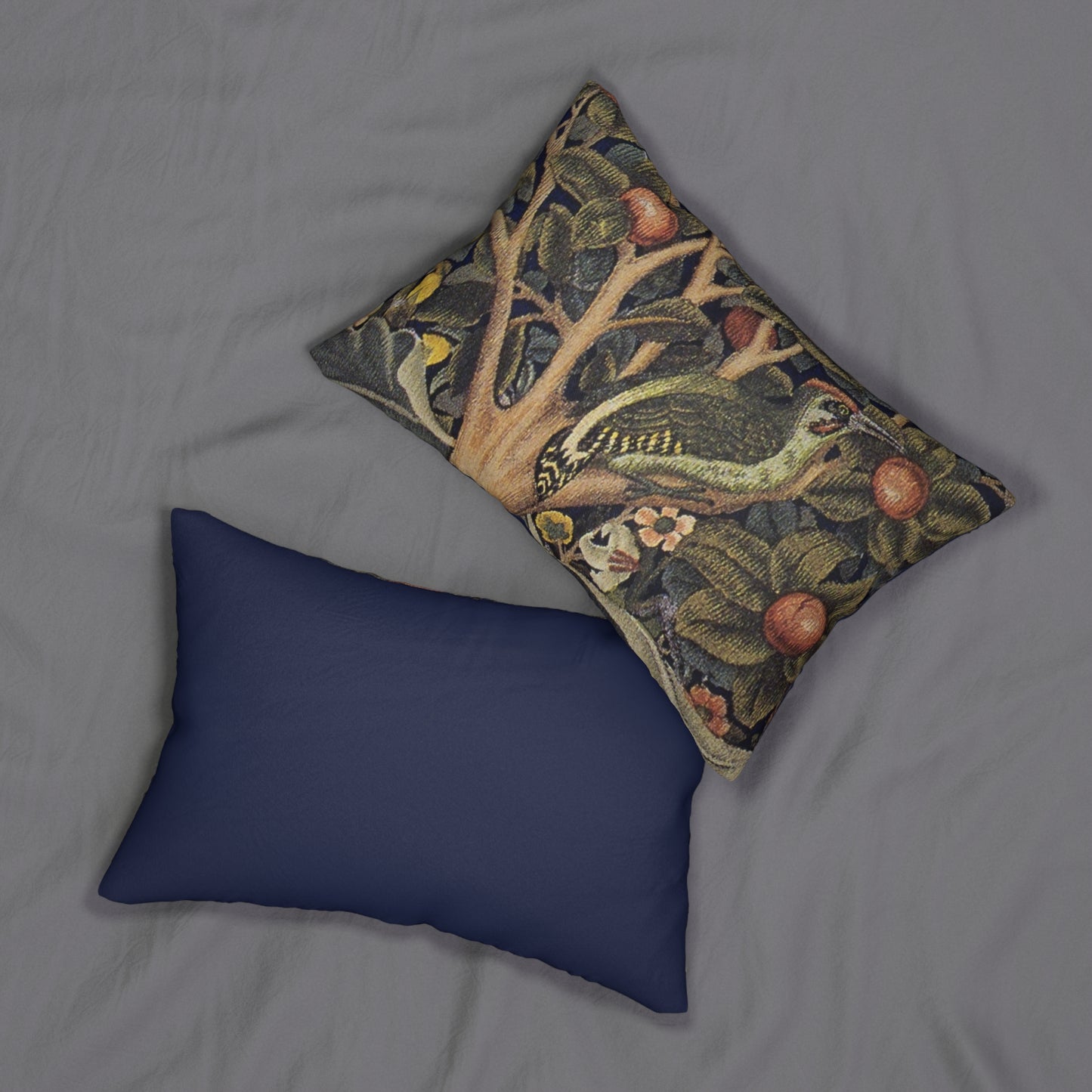 A decorative lumbar cushion featuring a historical floral and wildlife design inspired by William Morris.