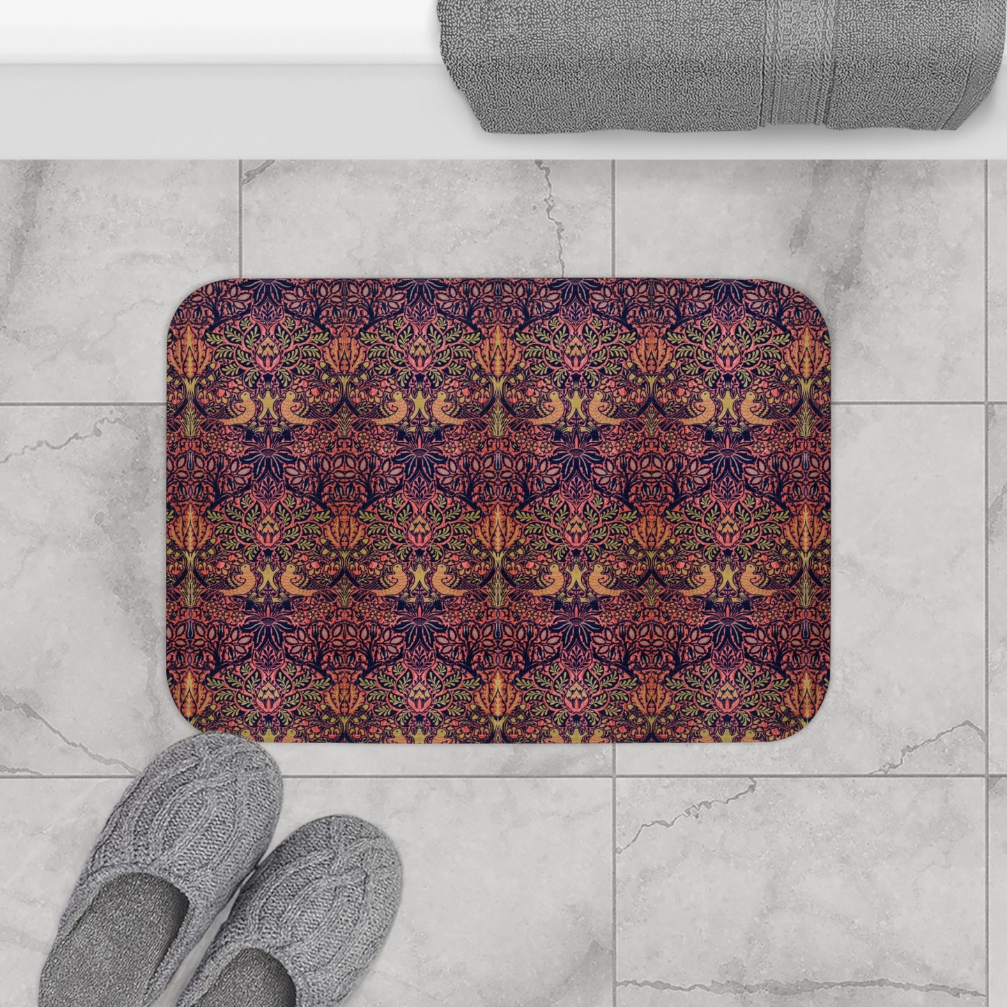 Patterned doormat on a marble floor with slippers and a towel.
