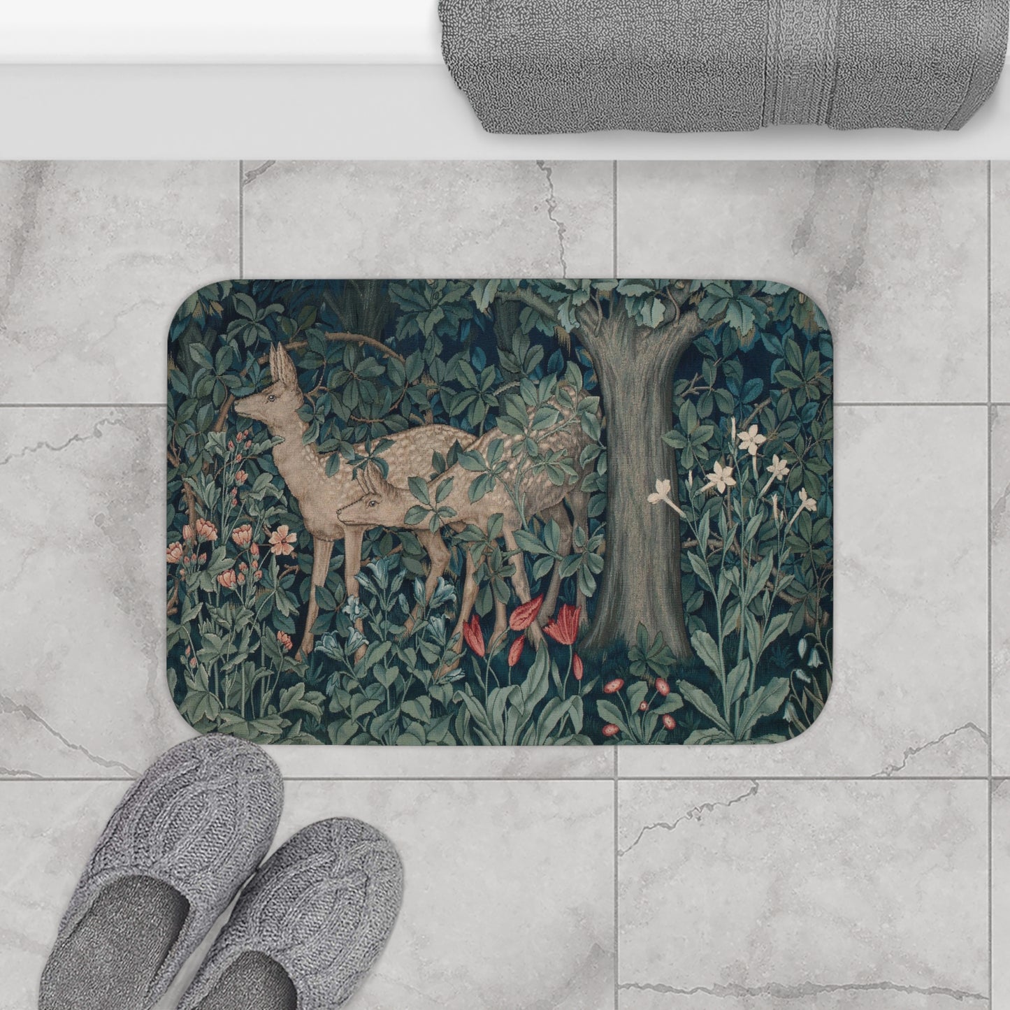 A microfibre bath mat featuring an intricate design of a deer in a forest setting, inspired by the William Morris tapestry.