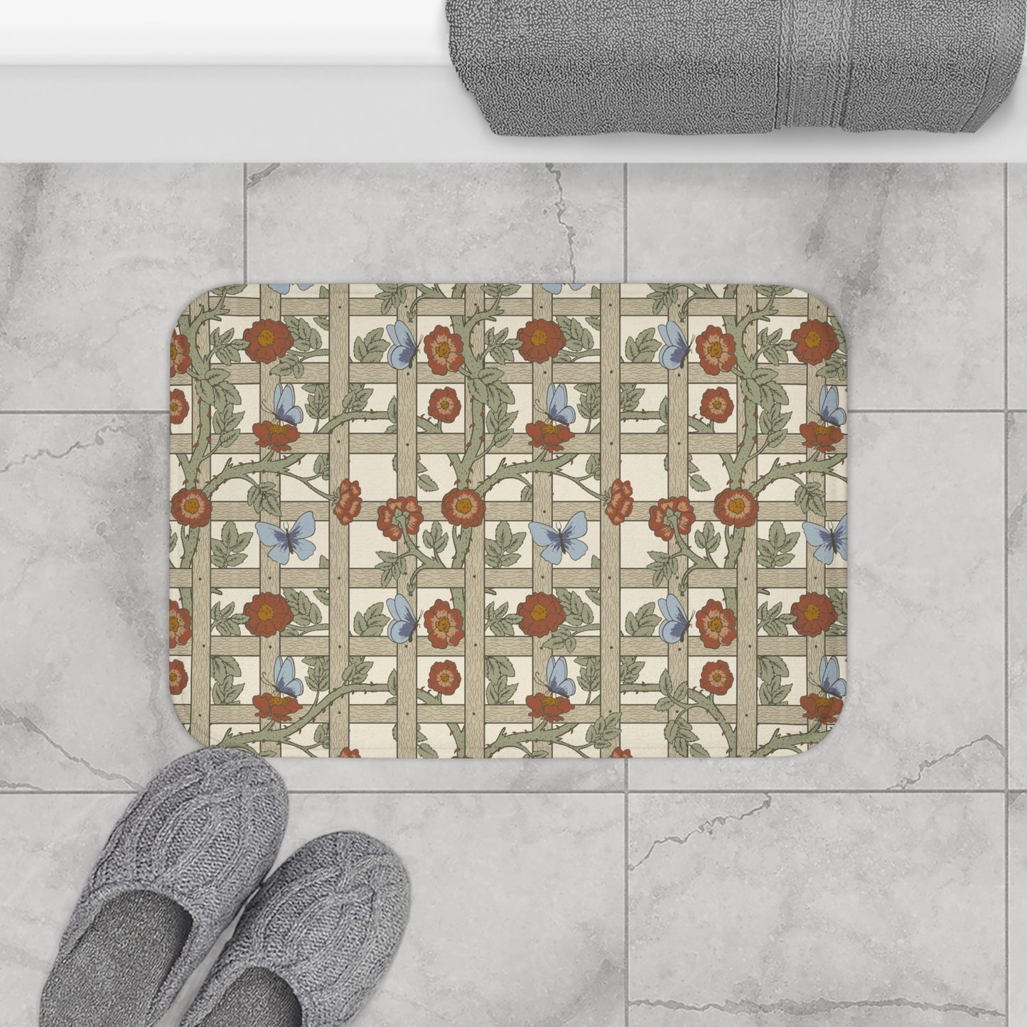 A microfibre bath mat with a floral pattern inspired by William Morris, featuring a grid of flowers and leaves.