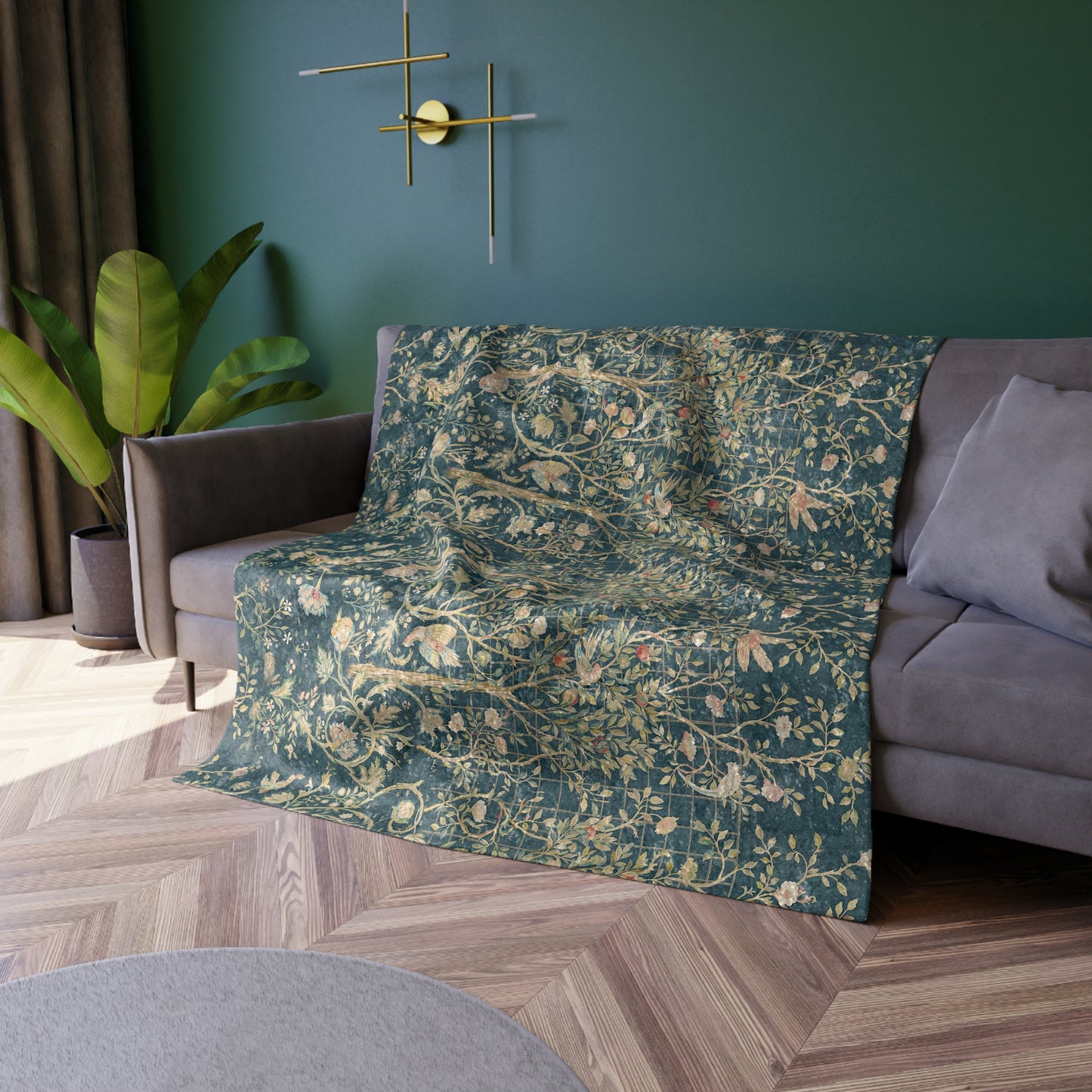A lush crushed velvet blanket with a floral William Morris & Co pattern in evergreen teal colours, hemmed edges and a silky finish.