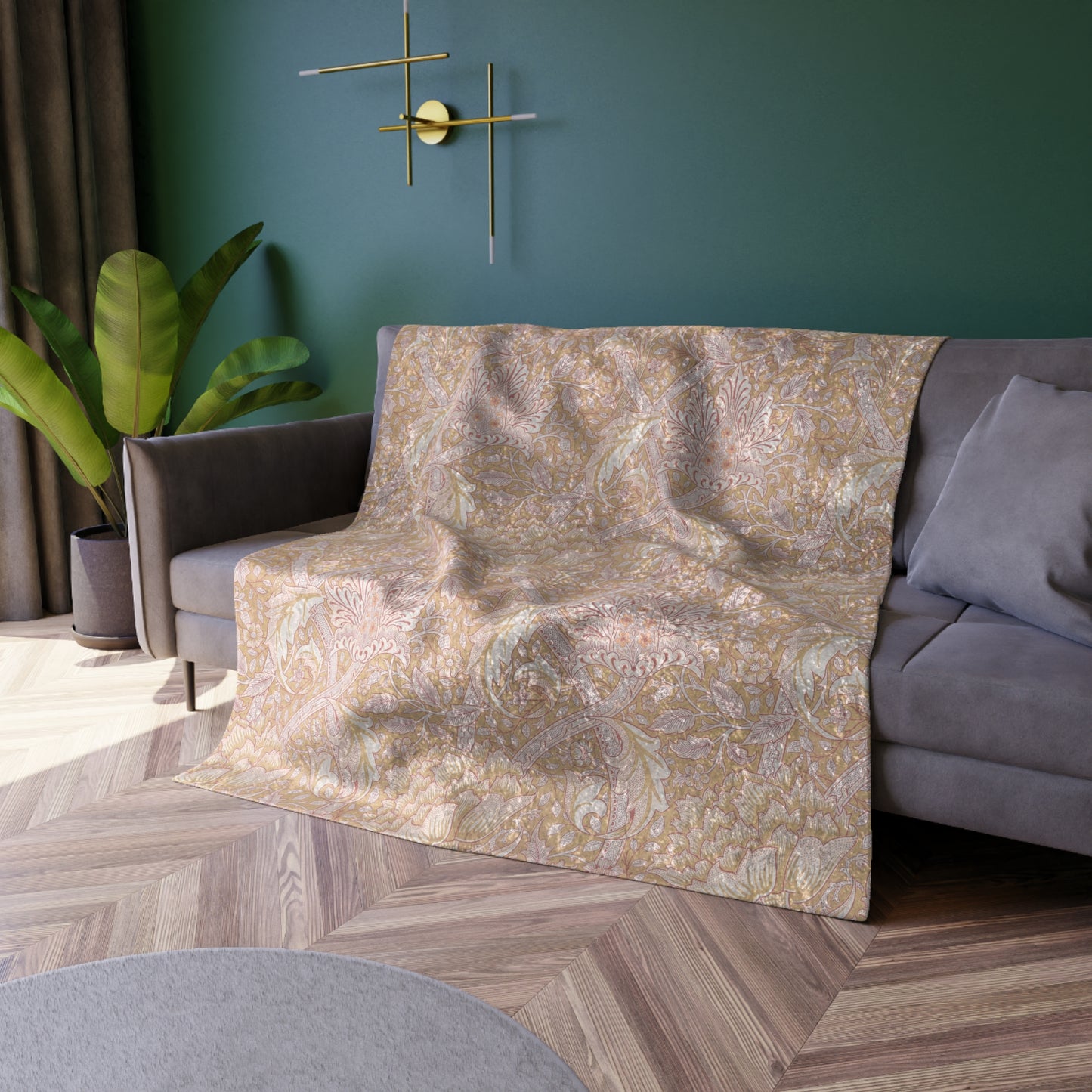 A plush, velvet blanket with a floral William Morris & Co pattern in muted colours, folded to show both the front and back.