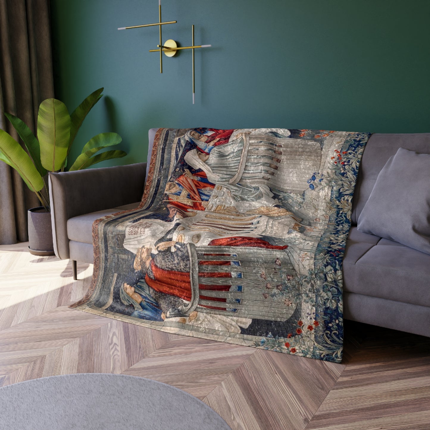 A plush velvet blanket with a geometric William Morris & Co pattern in a mix of gray, blue, and green colours, laid out flat.