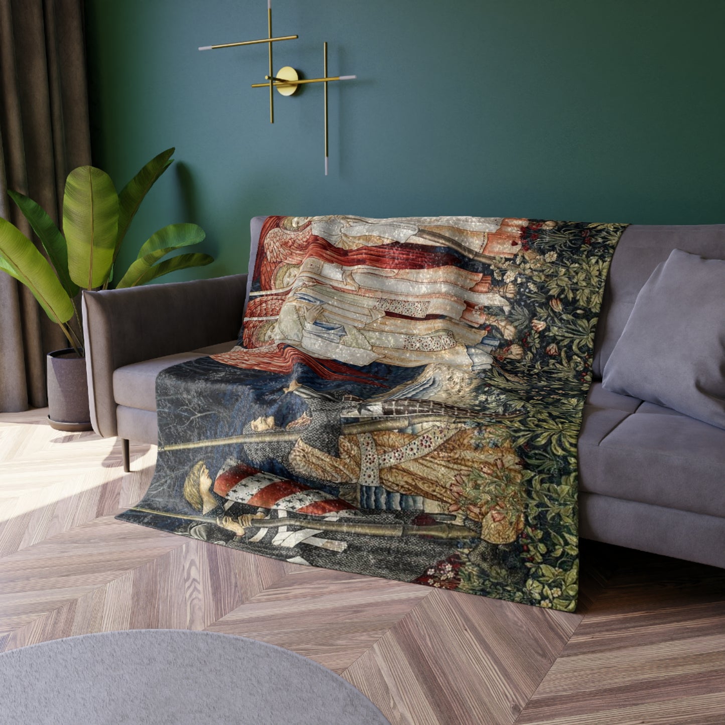 A crushed velvet blanket with a pattern inspired by William Morris' Holy Grail Collection, featuring red angels and other historical figures.
