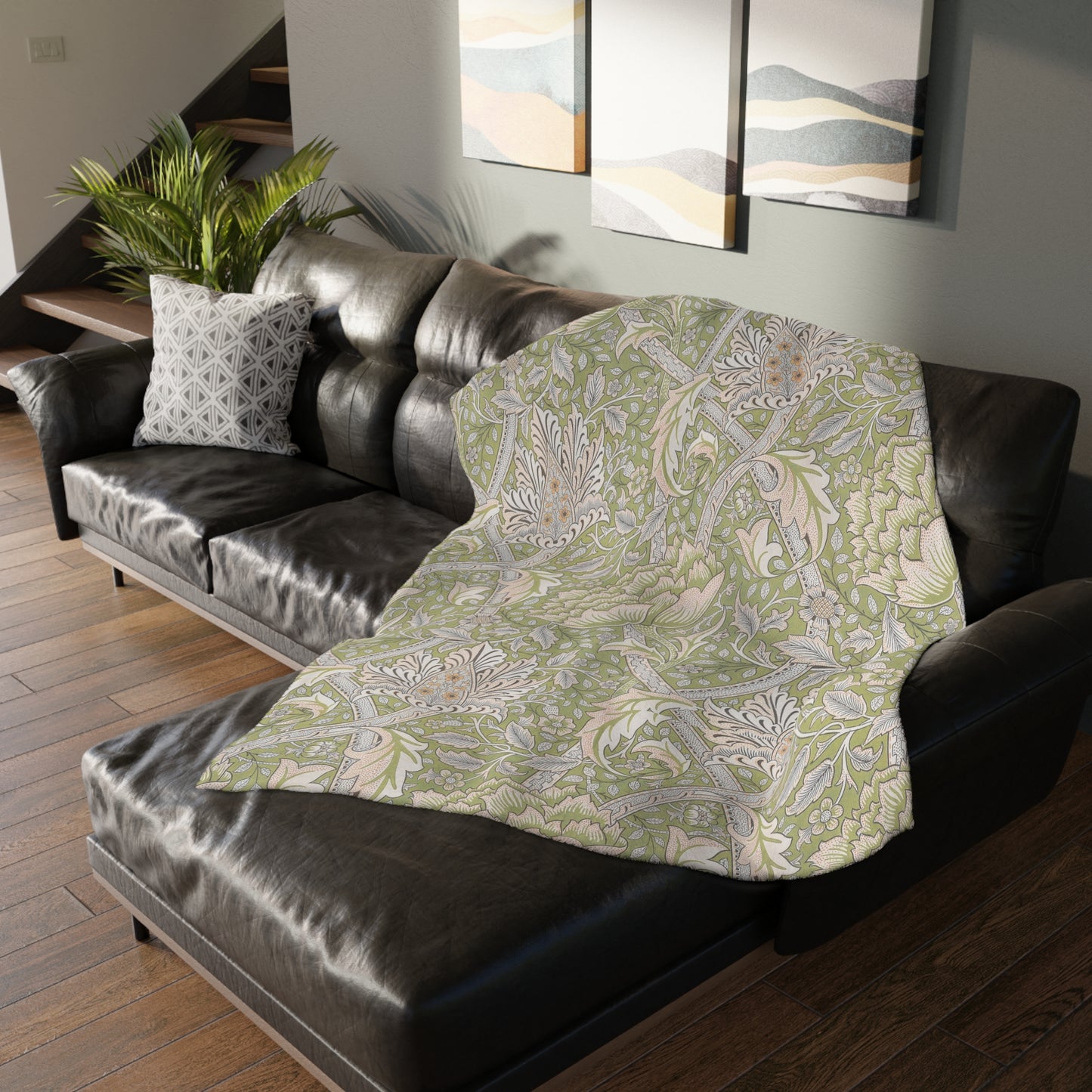 A luxury velveteen minky blanket with a two-sided print featuring William Morris & Co floral and leaf designs in green, pink, and beige tones.