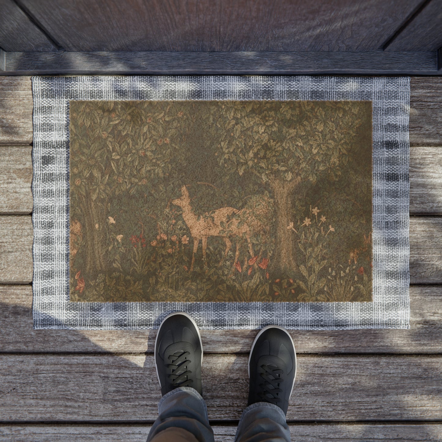 A rectangular coconut coir doormat featuring an intricate floral design with a central deer, inspired by the William Morris - Greenery Collection.