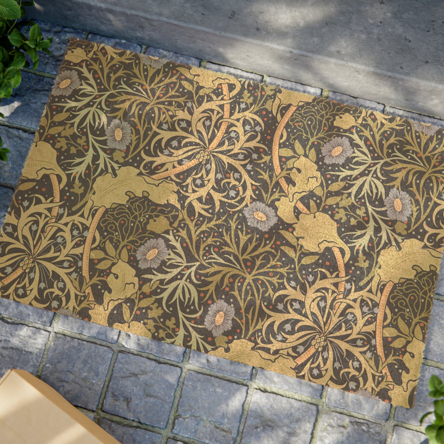 Rectangular coconut coir doormat with a floral William Morris & Co pattern in shades of blue and brown.