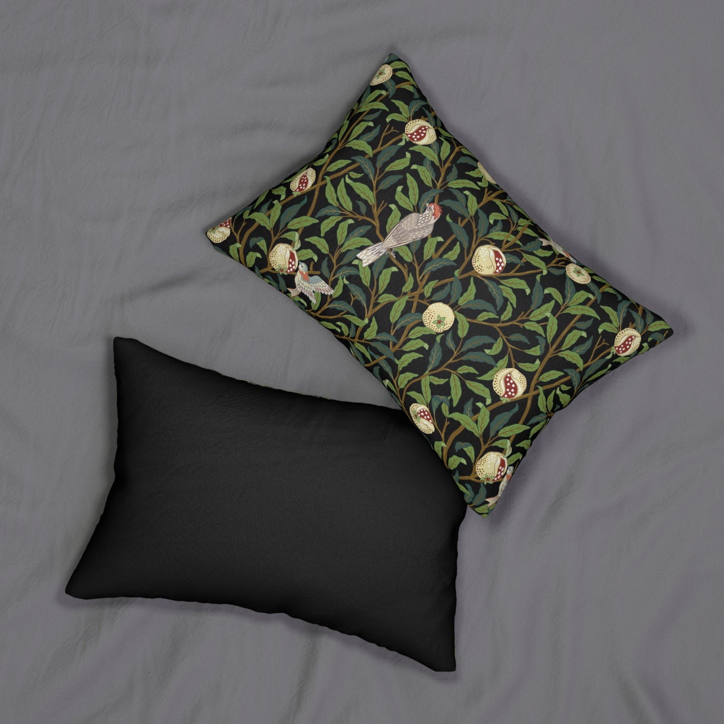 A rectangular William Morris & Co lumbar cushion with a bird and pomegranate design on a green background, featuring a concealed zipper.