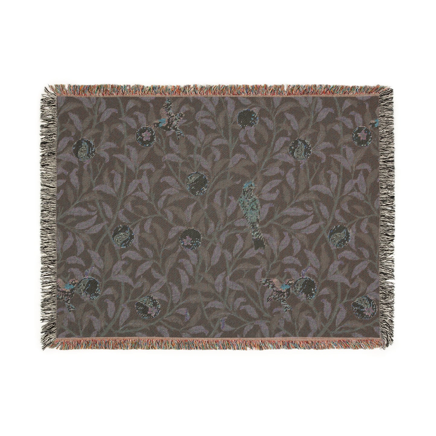 A woven cotton blanket with a geometric William Morris & Co pattern featuring birds and pomegranates in a onyx black colour, with fringed edges.