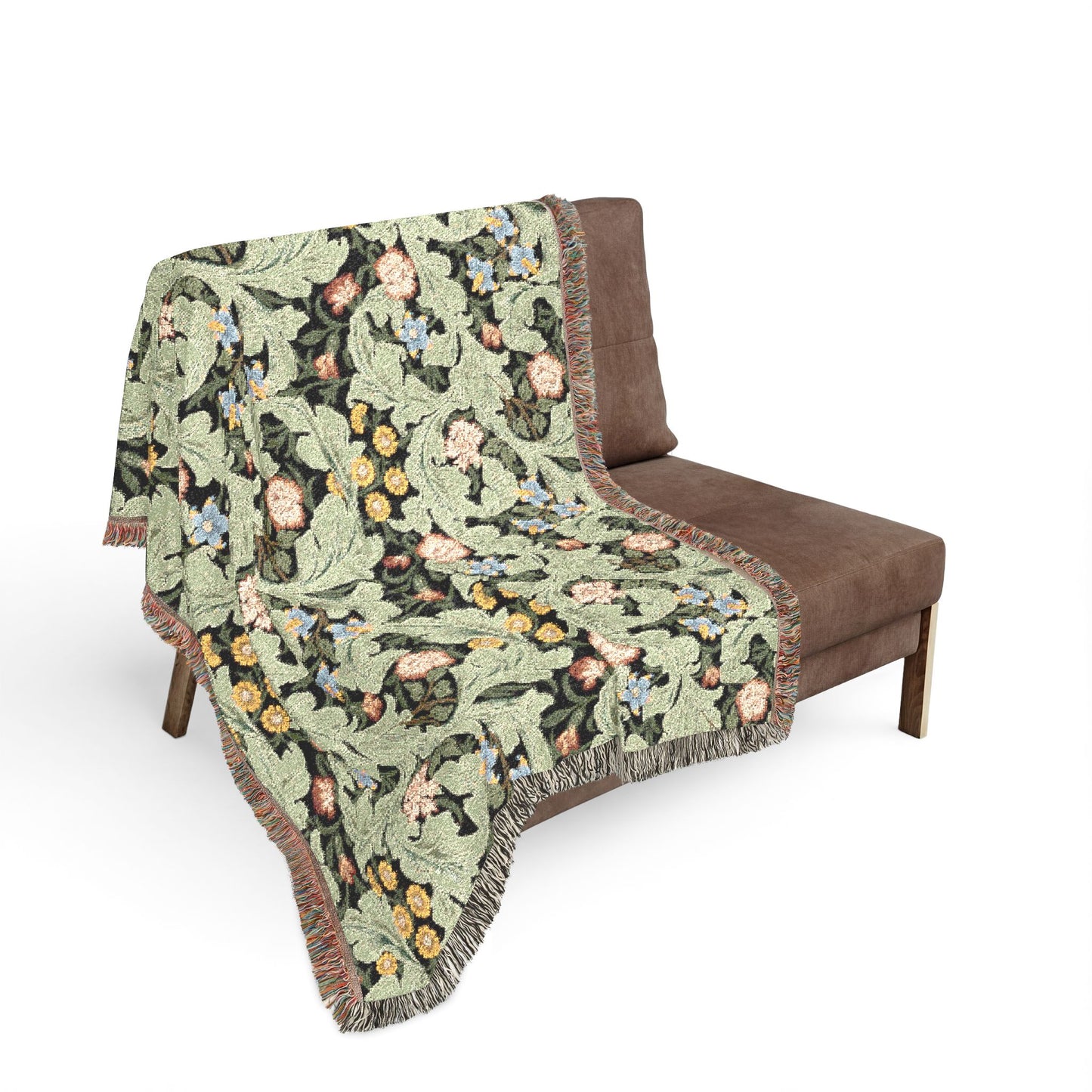 Floral patterned blanket draped over a brown chair on a white background