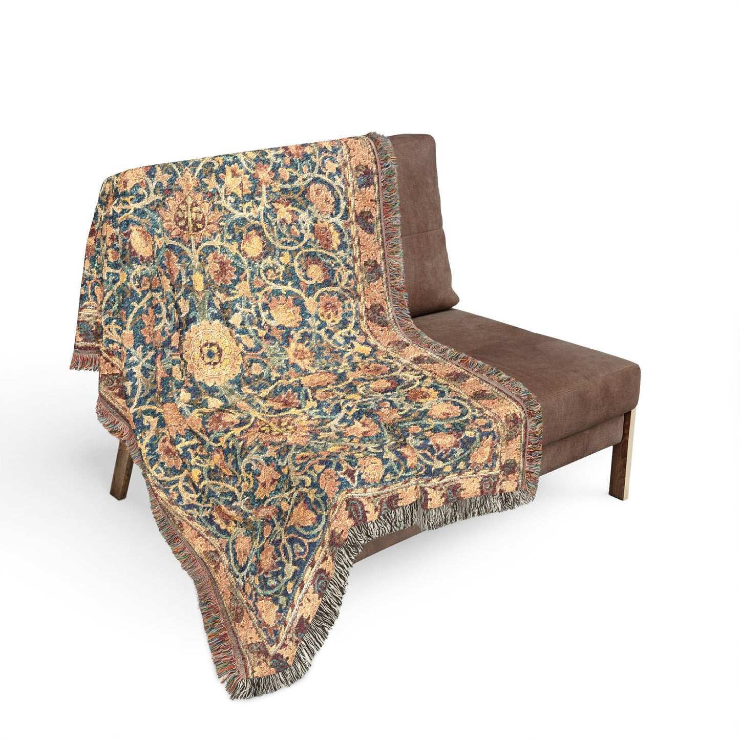 Decorative floral-patterned throw blanket draped over a brown chair on a white background