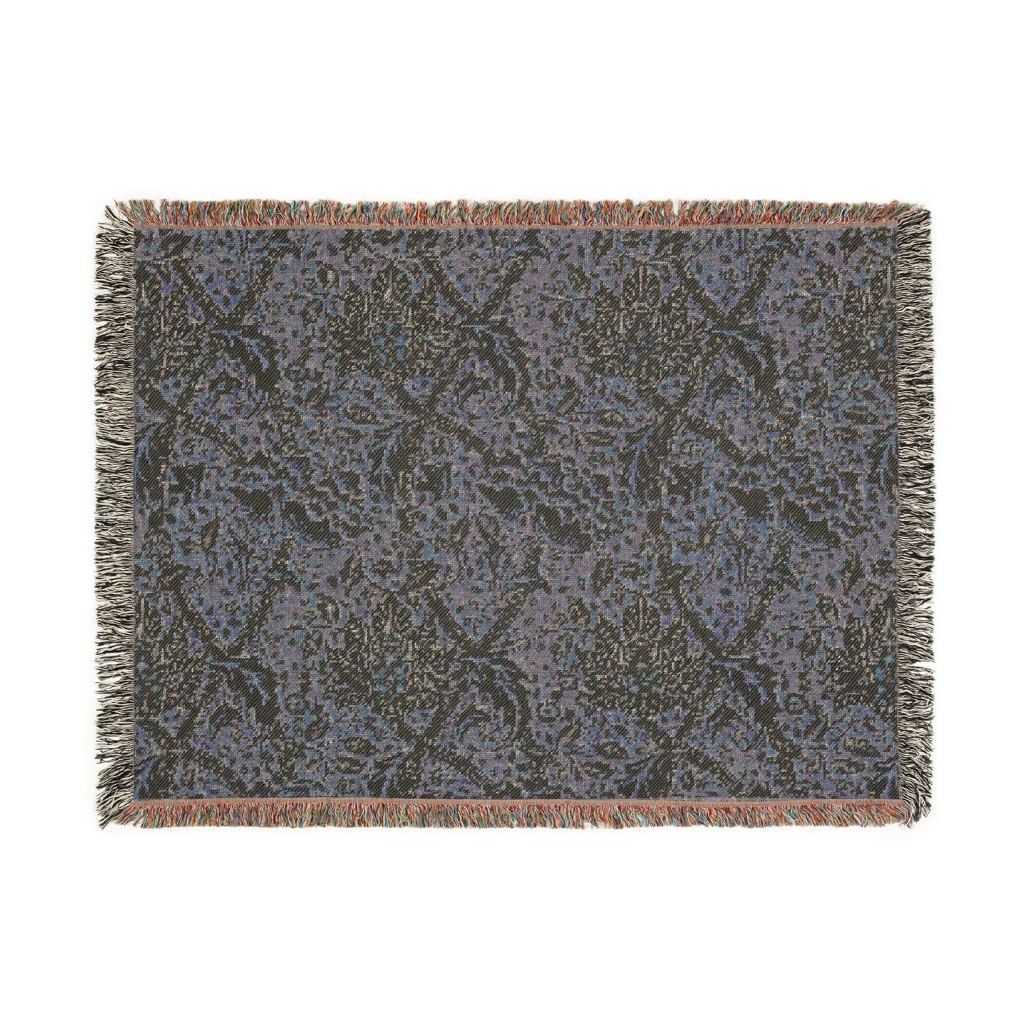 A woven cotton blanket with a floral Willy Morris & Co pattern in shades of green and beige, with a colourful fringed edge.