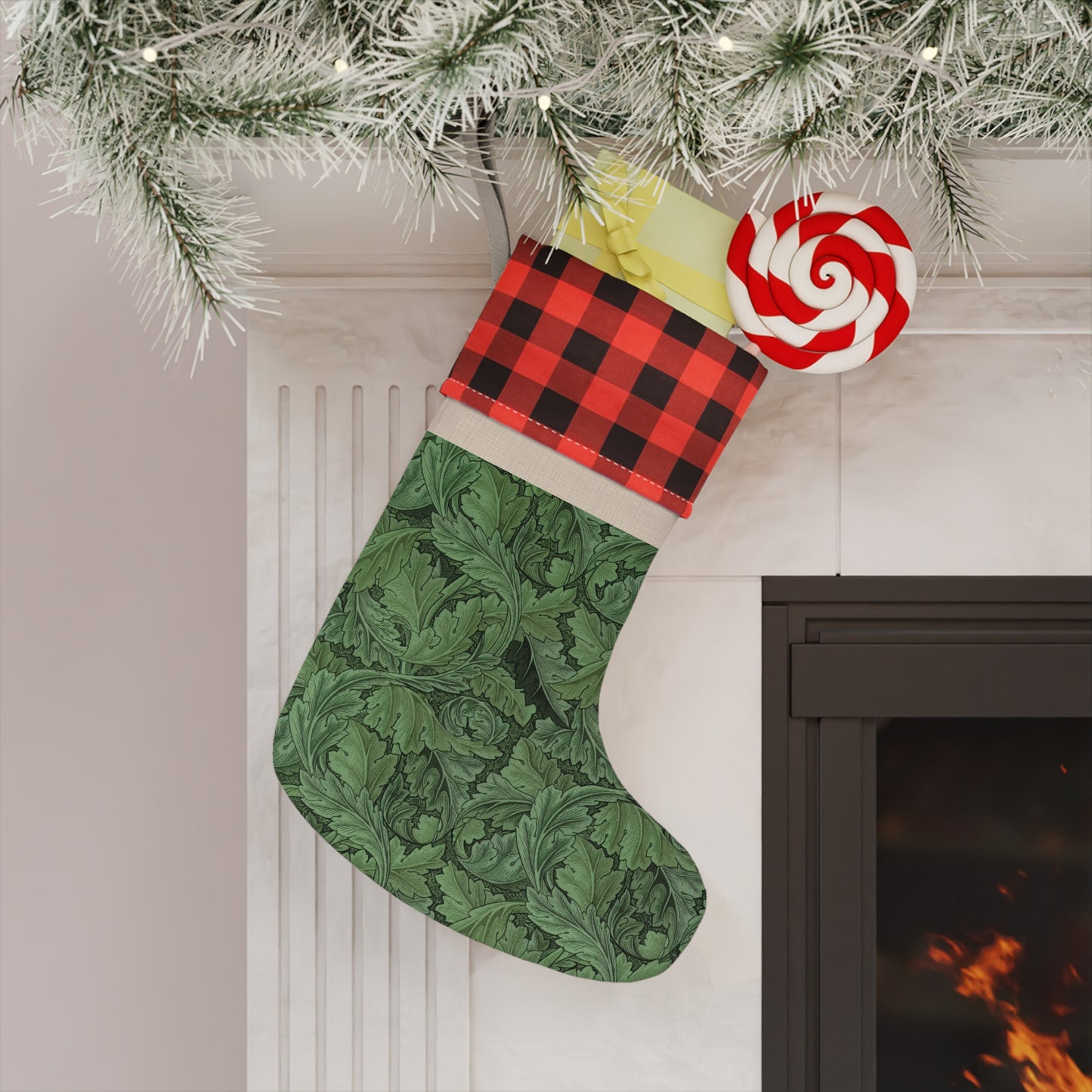 A green Christmas stocking with a black and white checkered top cuff and a wooden hanging loop in a William Morris & Co pattern.
