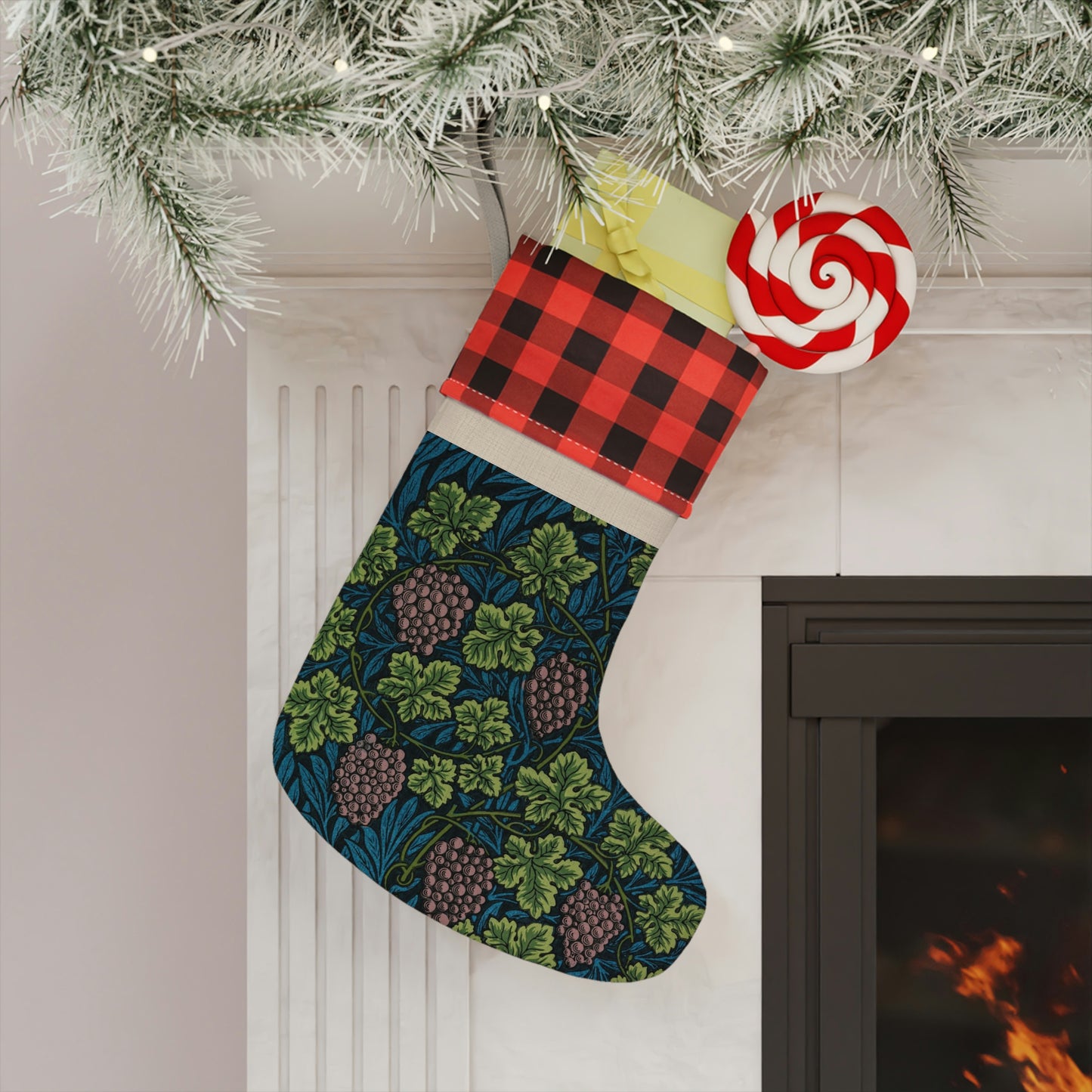 A one-sided printed Christmas stocking with a William Morris & Co floral vine design in shades of green, blue, and beige, featuring a black and white checkered cuff.