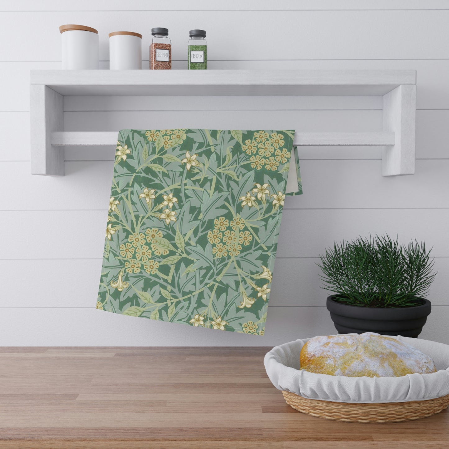 A kitchen tea towel with a green floral pattern inspired by William Morris & Co- Jasmine Collection.