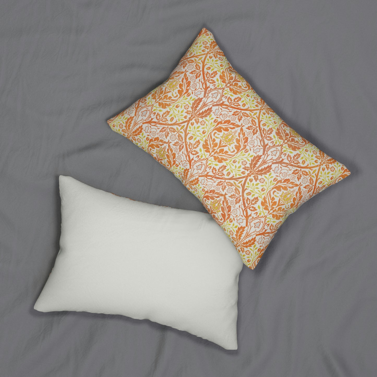 A rectangular lumbar cushion with a William Morris & Co floral pattern in shades of orange, beige, and yellow, featuring a concealed zipper.