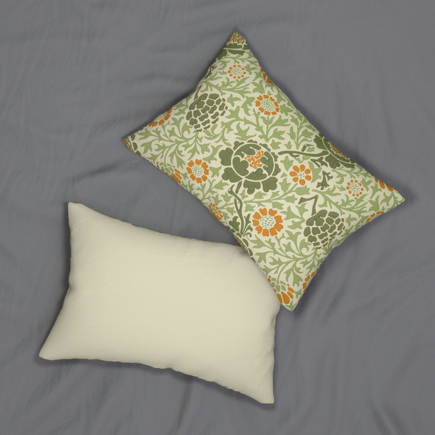 A rectangular lumbar cushion with a William Morris & Co floral pattern in green, beige, and orange colours, featuring a concealed zipper.