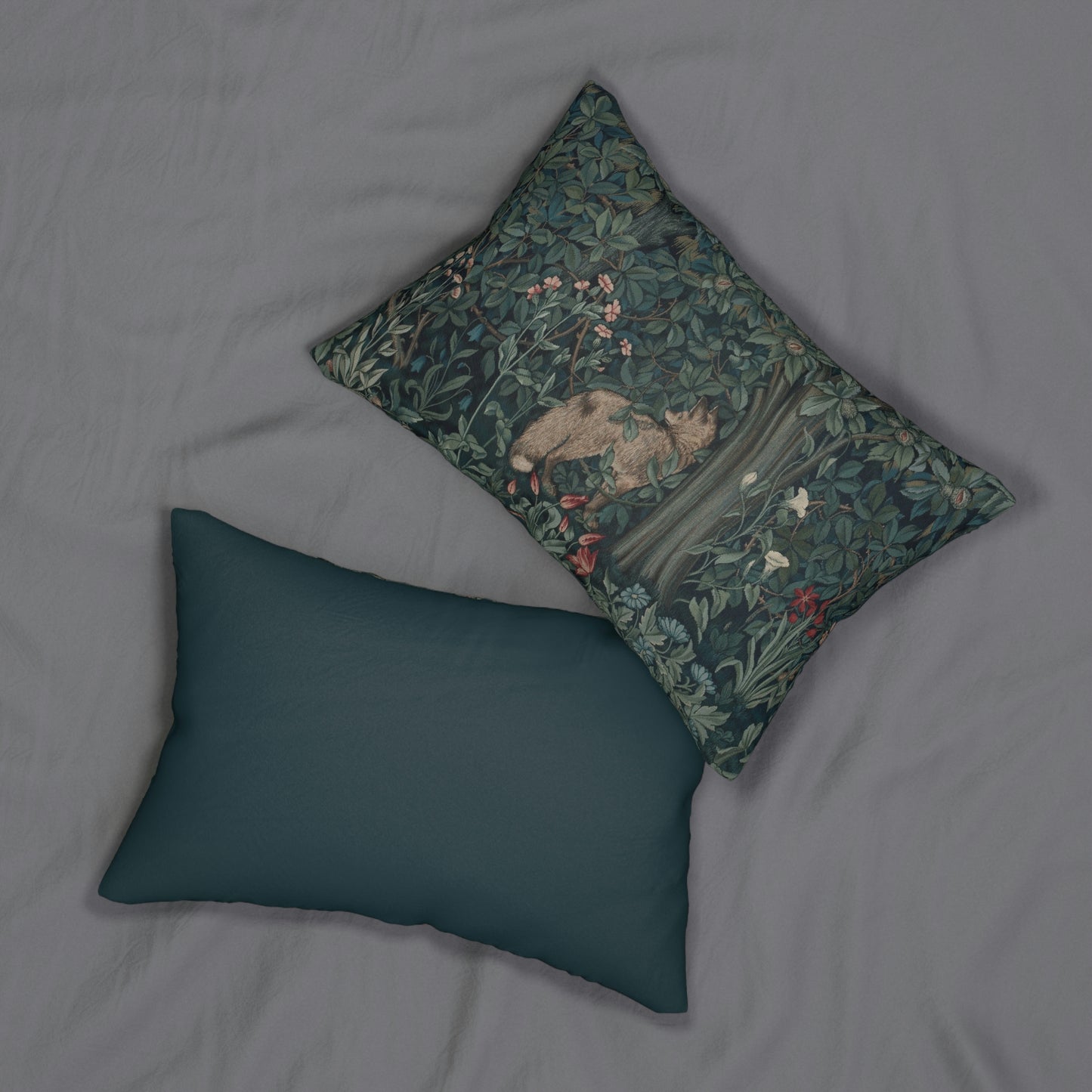 A rectangular lumbar cushion with a floral pattern featuring a bear, designed by William Morris & Co, in a forest green colour.