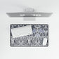 Floral patterned desk mat with a computer setup on a white background