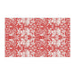 A rectangular tea towel featuring a bold red and off-white floral and botanical pattern, shown flat against a plain white background.
