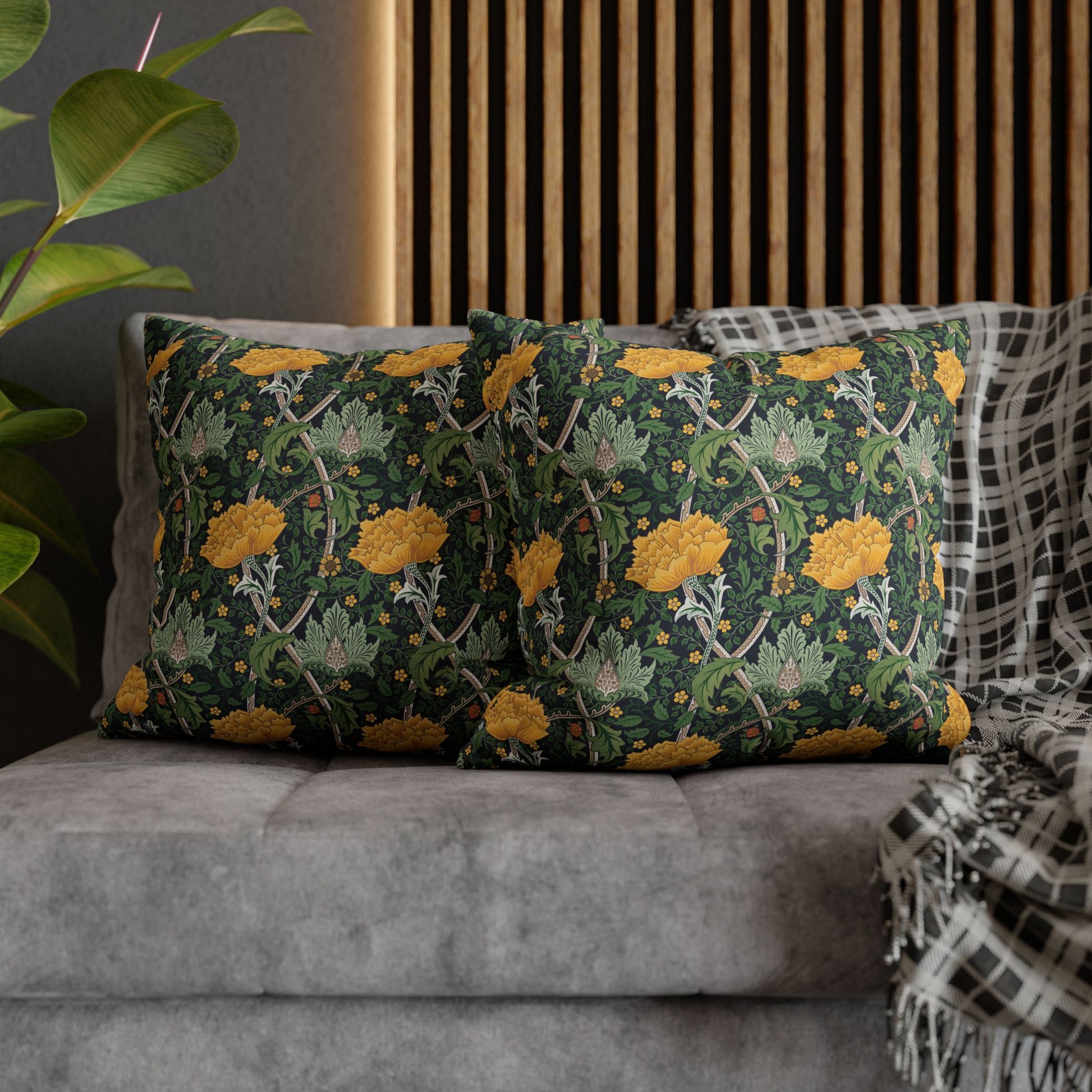 Decorative pillows with floral pattern on a gray sofa