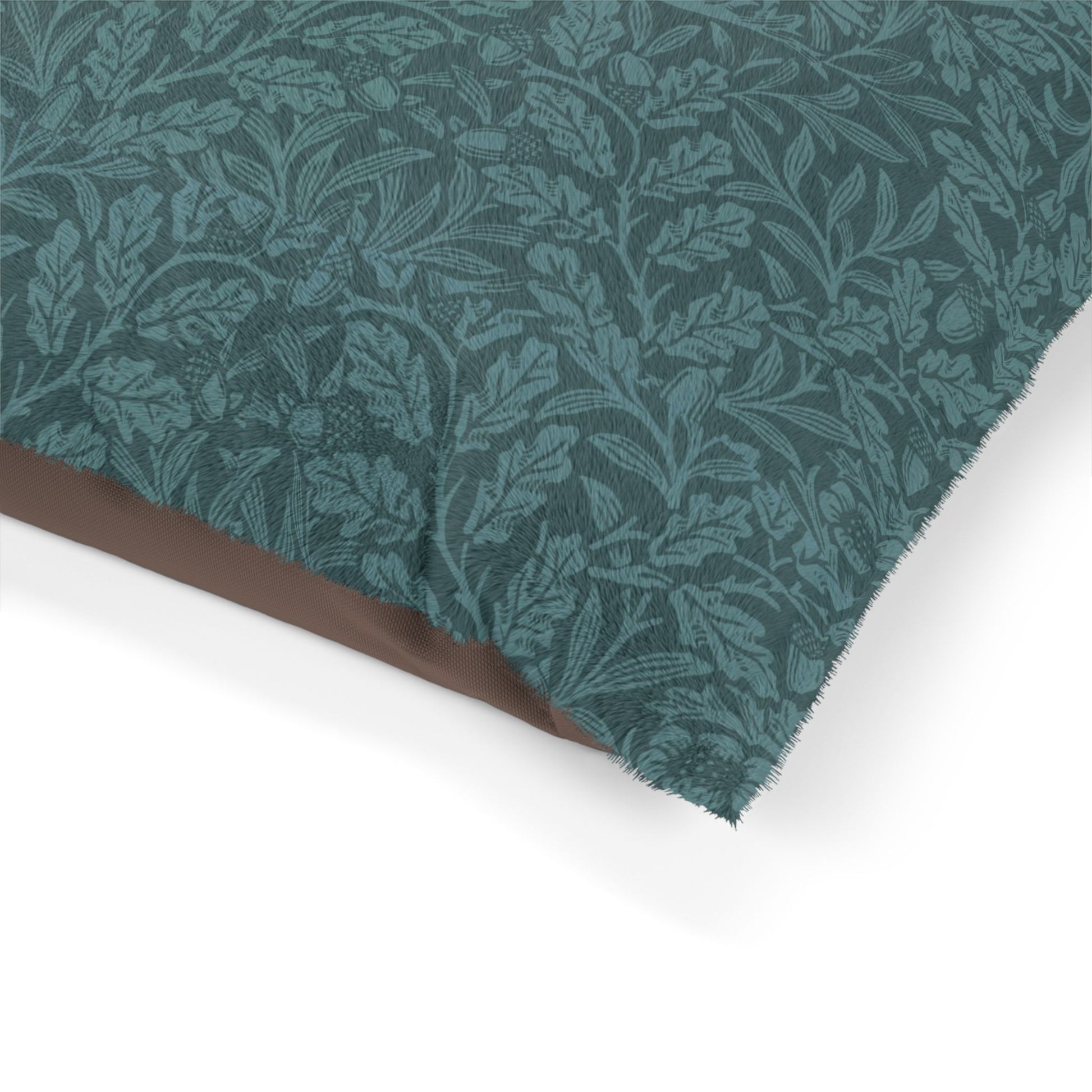 Teal fabric with leaf pattern on a white background