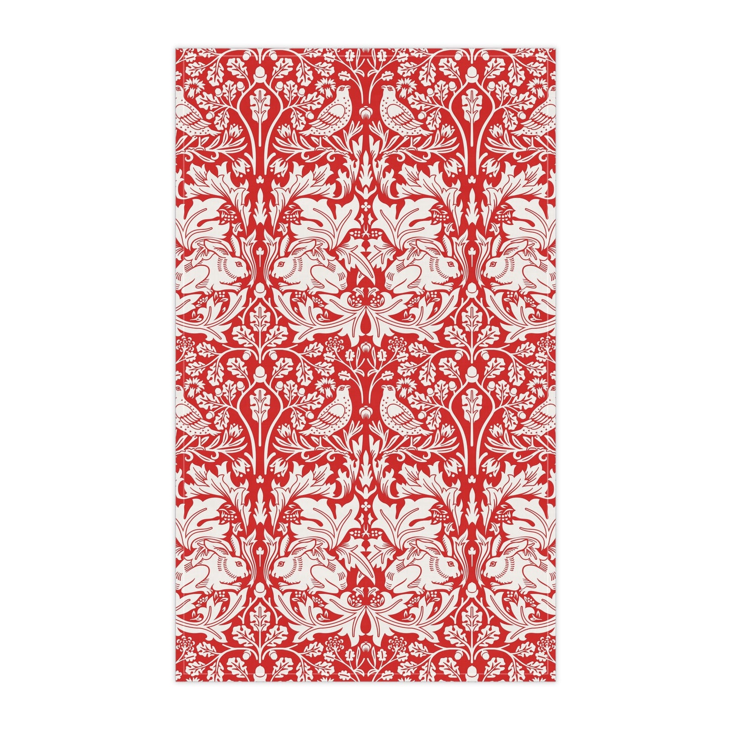 A rectangular tea towel featuring a classic red and white botanical pattern with stylised leaves and small birds, shown flat against a white background.