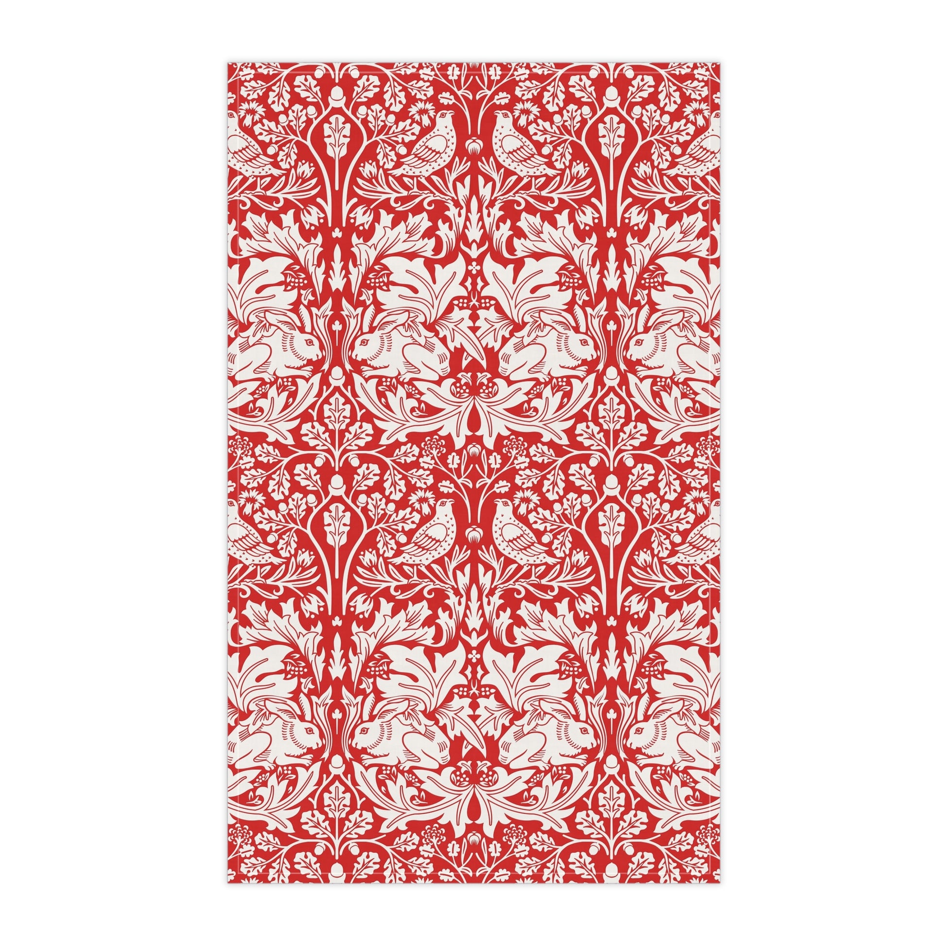 A rectangular tea towel featuring a classic red and white botanical pattern with stylised leaves and small birds, shown flat against a white background.