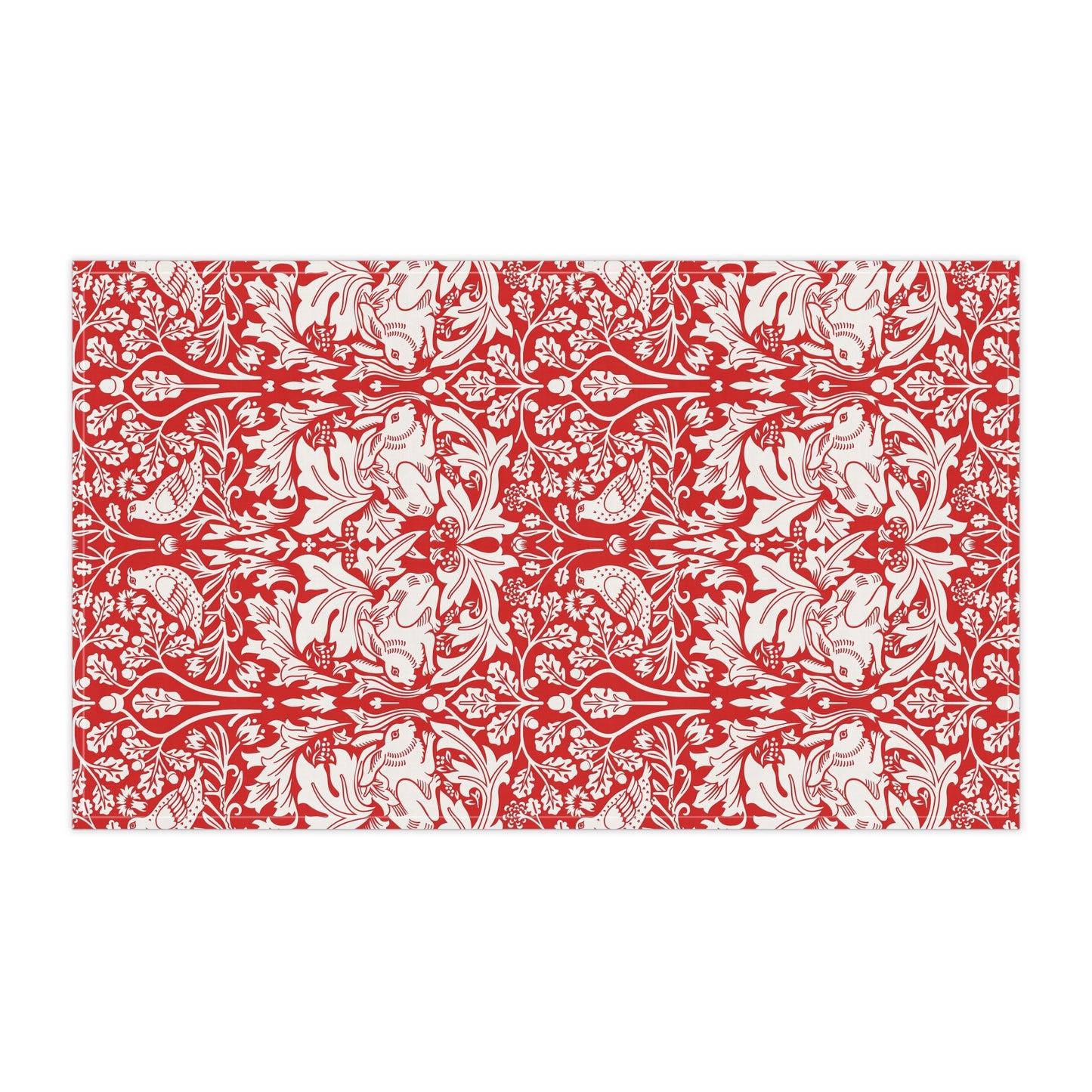 A rectangular tea towel featuring a bold red and off-white floral and botanical pattern, shown flat against a plain white background.