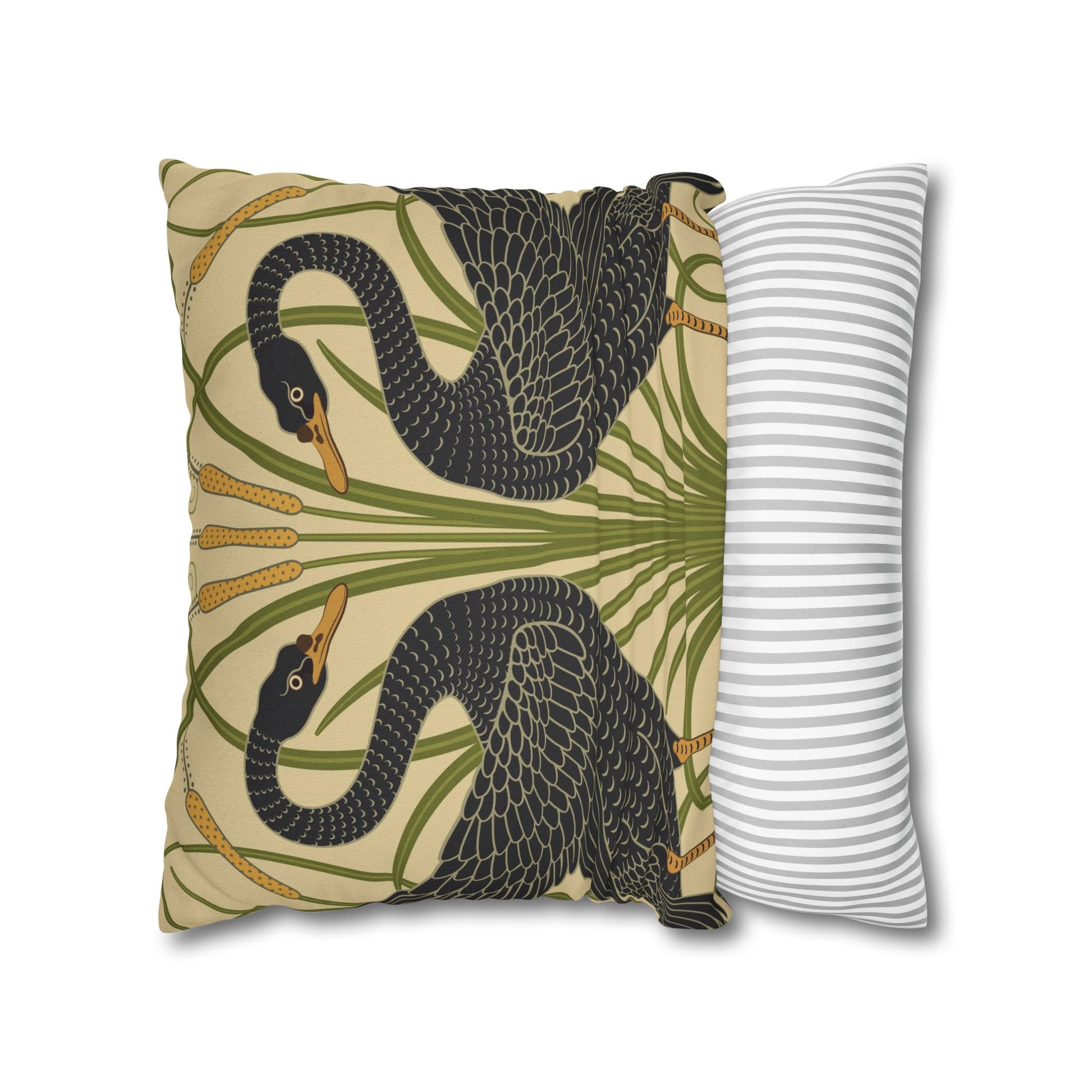 Decorative pillow with black swan design and a striped pillow next to it on a white background