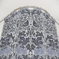 Patterned fabric with birds and floral designs on a white background