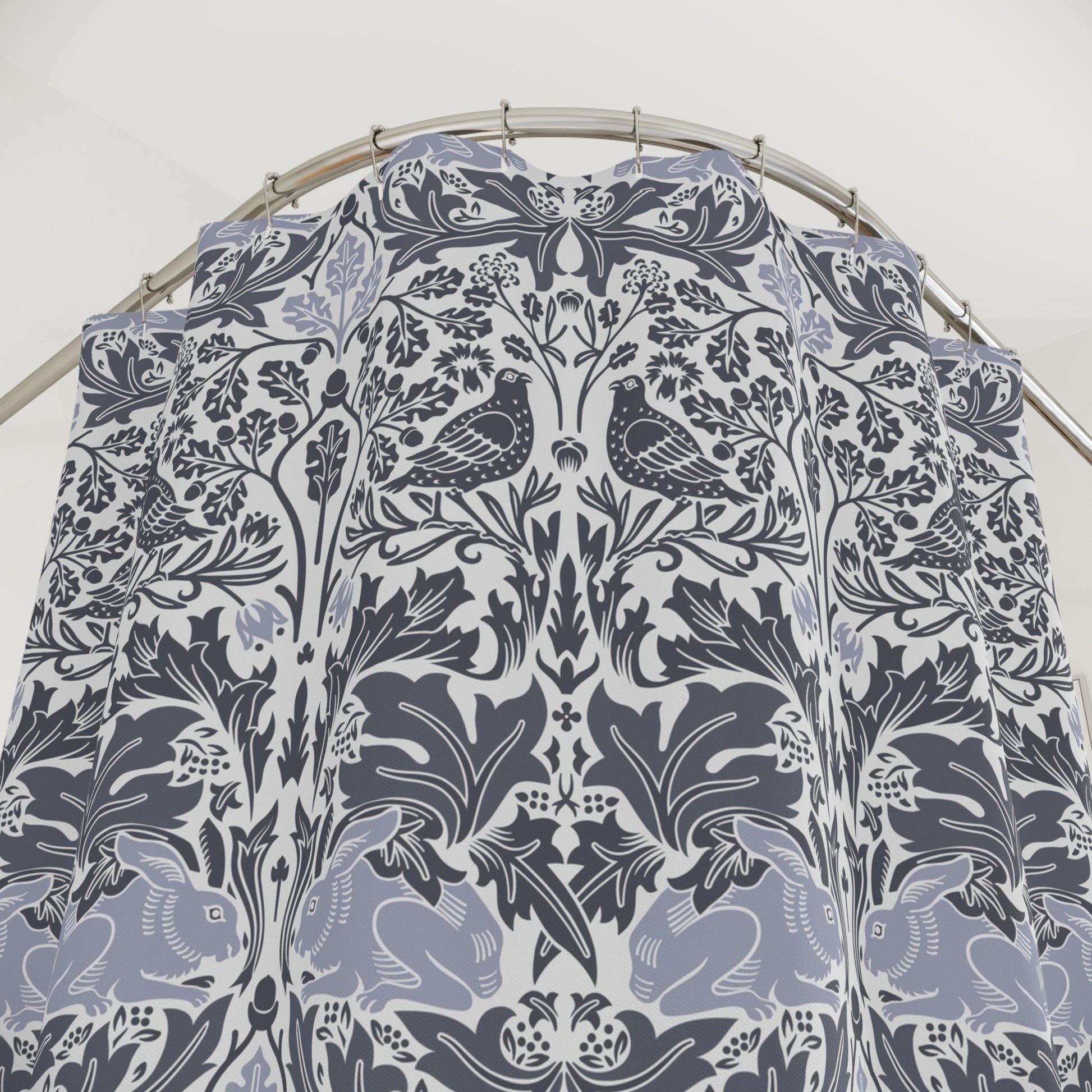Patterned fabric with birds and floral designs on a white background