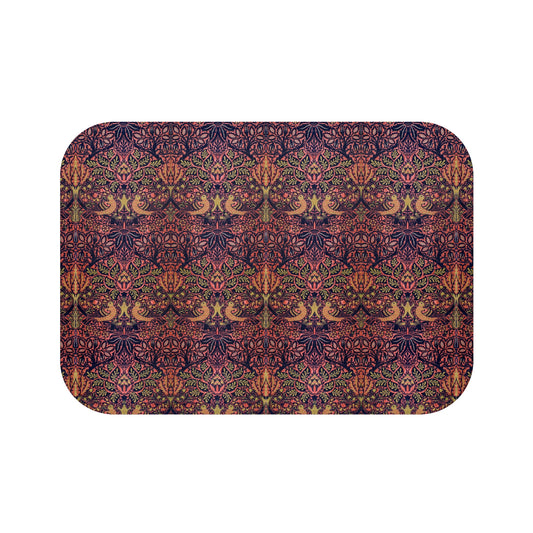 Rectangular microfibre bath mat with a floral pattern inspired by William Morris, in colors pink, purple, and gold.