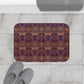 Rectangular microfibre bath mat with a floral pattern inspired by William Morris, in colours pink, purple, and gold.