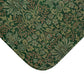 Rectangular microfibre bath mat with an intricate floral pattern in green shades, inspired by William Morris.